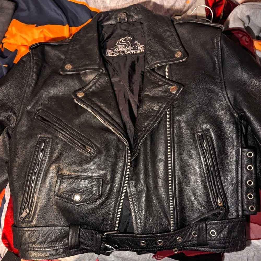 Genuine leather biker jacket, size small. It's in excellent condition.